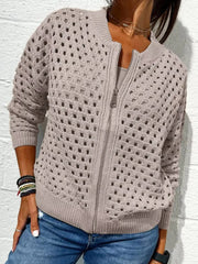 Front view of a light taupe openwork crochet cardigan with a front zip