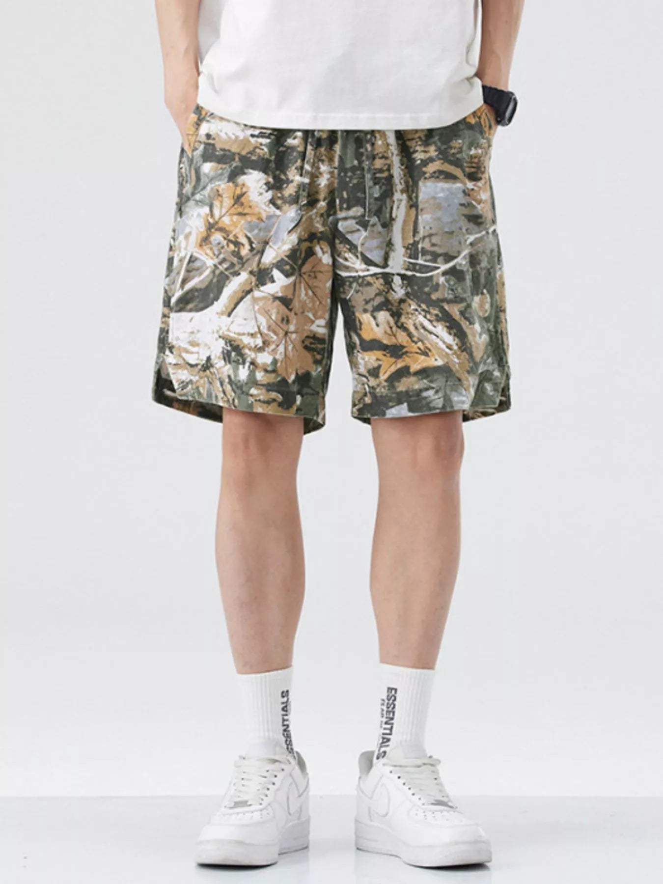 Men's loose fit shorts with a drawstring waist and pockets.