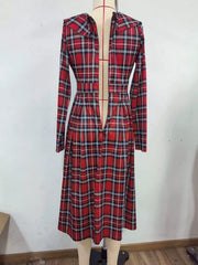 Back view of burgundy plaid long sleeve midi dress on a mannequin, showing center back opening