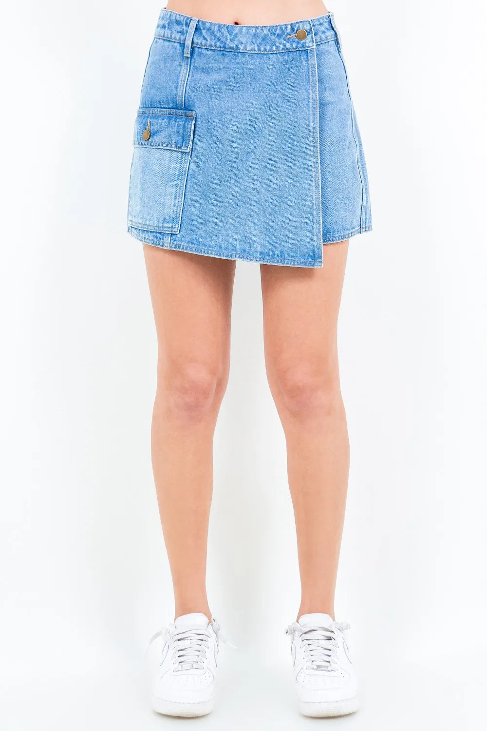 Women's blue mini denim skort with cargo pockets and a button waist closure.