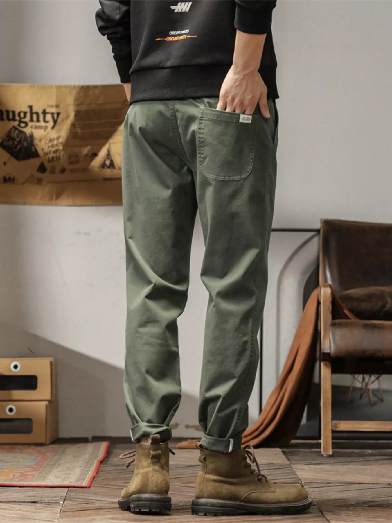 Men's slim fit casual pants with banded ankles and pockets.