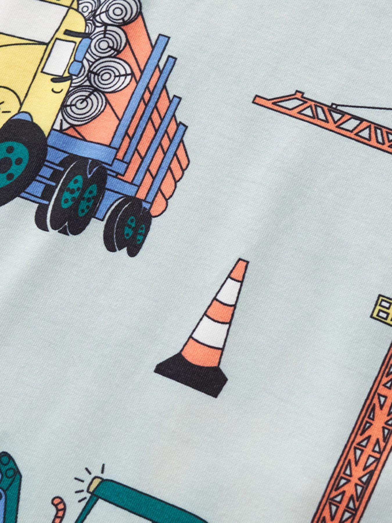 Close-up of the yellow truck and orange traffic cone print on the children's tee