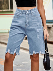 Women's denim shorts with raw hems in a non-stretch rayon blend.