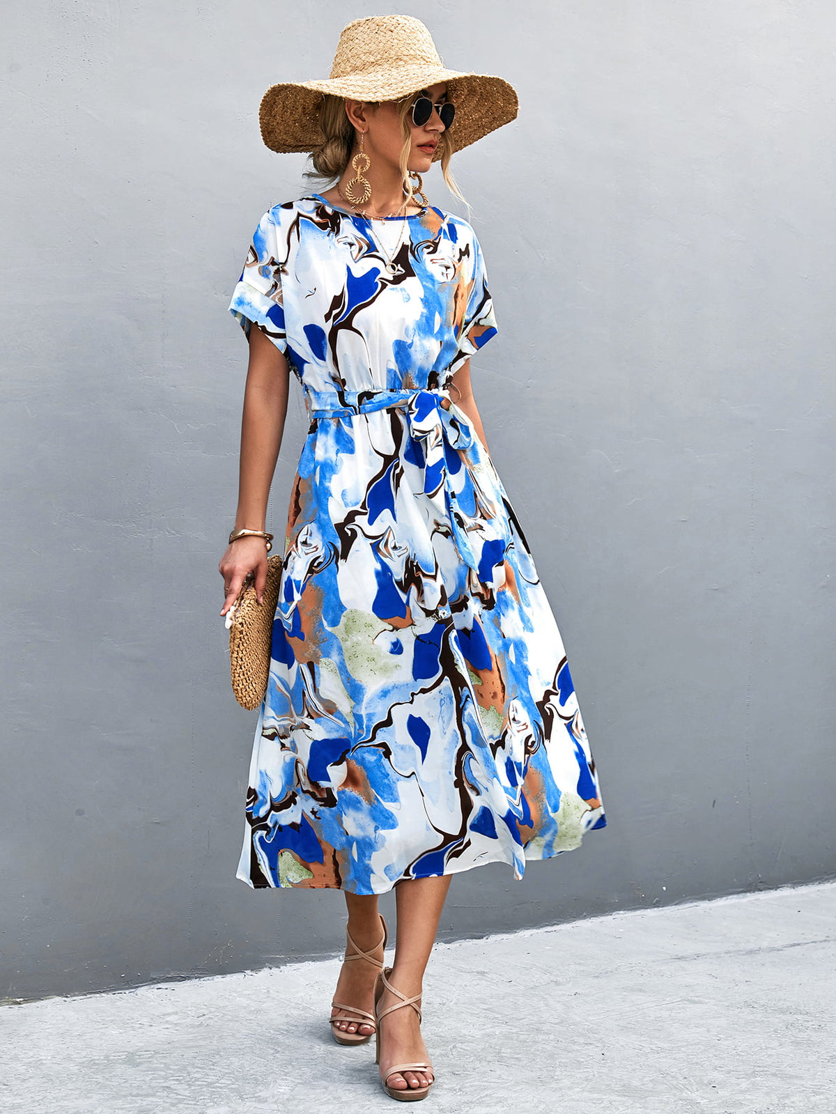 Women's blue A-line midi dress with a round neckline, short sleeves and tie waist.