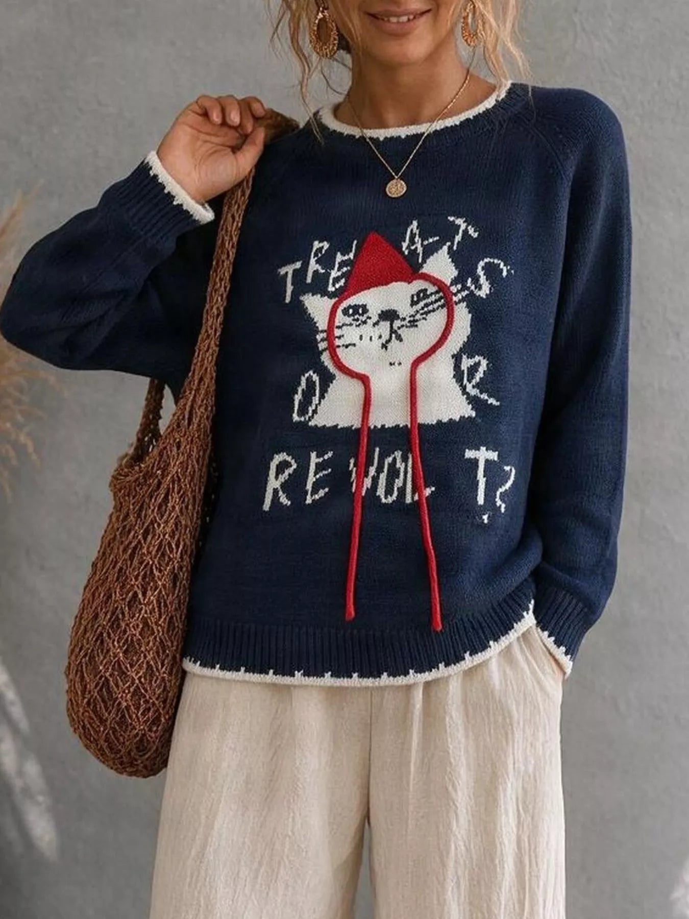 Navy cat sweater with white cat graphic and red hood strings
