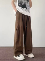 Men's brown loose-fit casual cargo pants with a drawstring waist and pockets.