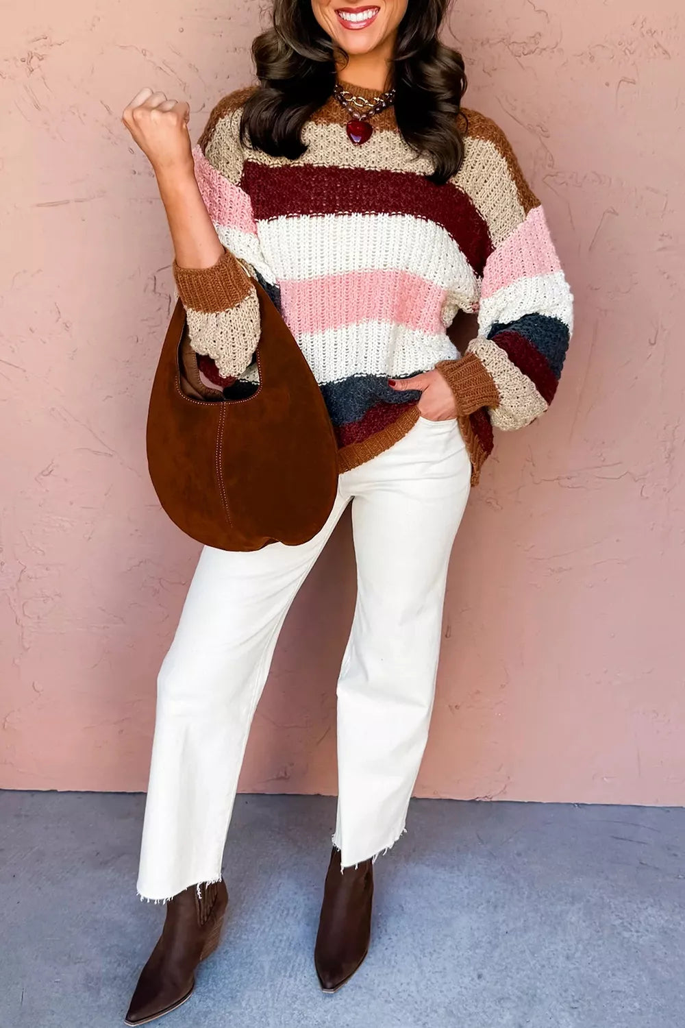 Full length front view of multicolor striped knit sweater with shoulder bag