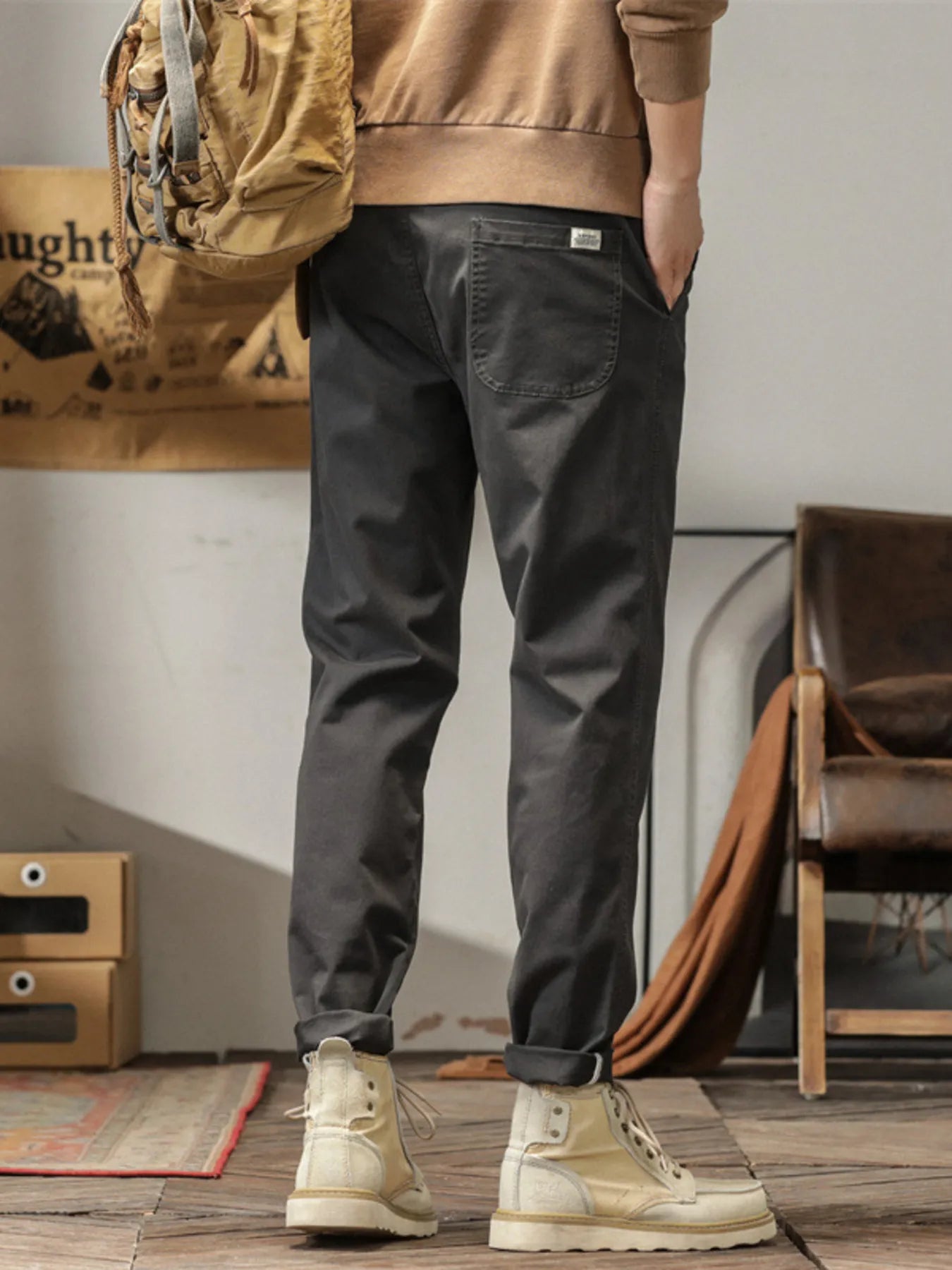 Men's slim fit casual pants with banded ankles and pockets.