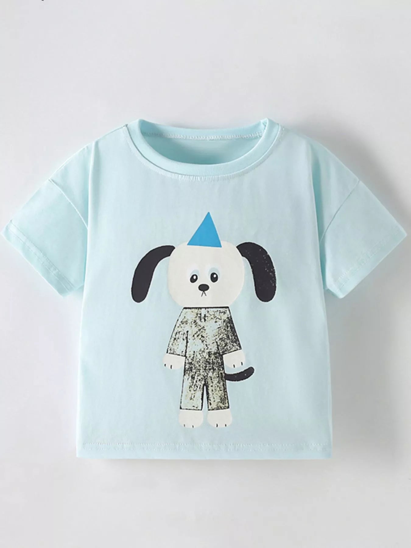 Mint blue children's short sleeve t-shirt with cartoon dog in patterned outfit, front flat view