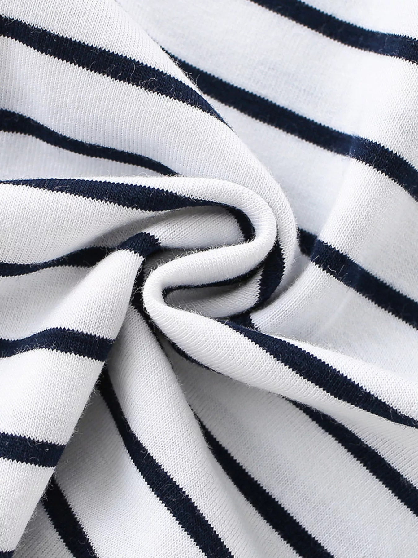 Close-up of the soft white and navy striped fabric showing its texture and drape