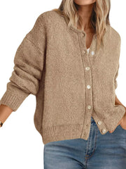 Front view of khaki button down knit cardigan with white buttons over jeans on white background