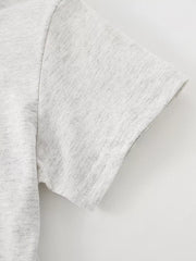 Close view of the short sleeve hem and stitching on the light gray children's T-shirt