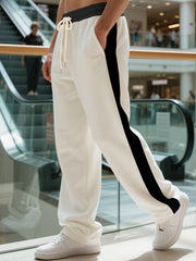 Men's contrast stripe sweatpants with a drawstring waist and pockets.