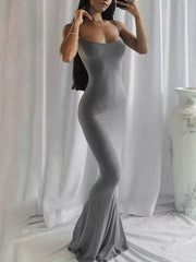 Full length mirror view of a dark gray spaghetti strap bodycon maxi dress with a flared hem