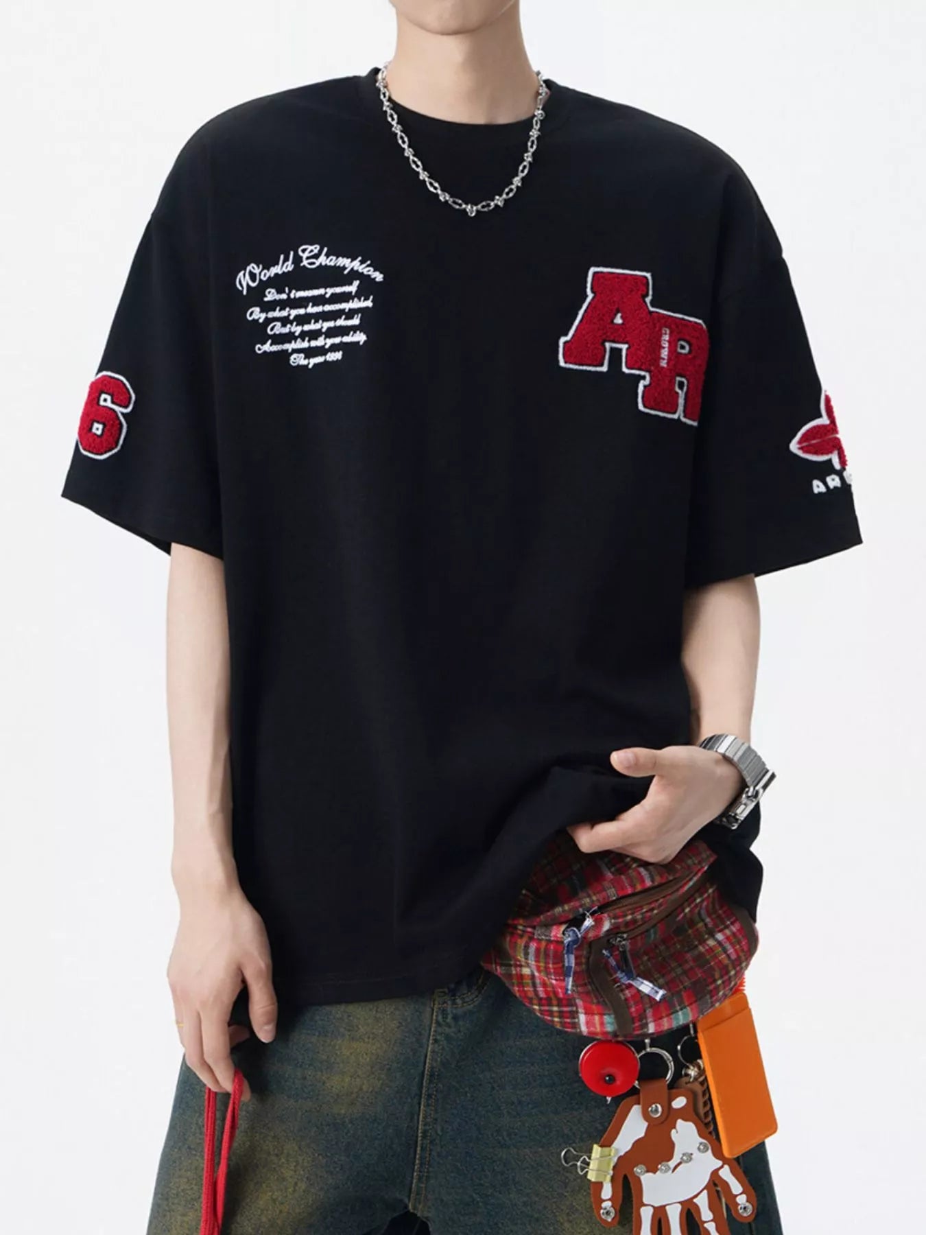 Men's varsity-style round-neck T-shirt with applique detailing in a cotton-spandex blend.