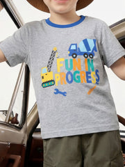 Gray children's t-shirt with construction vehicles and colorful lettering, worn front view