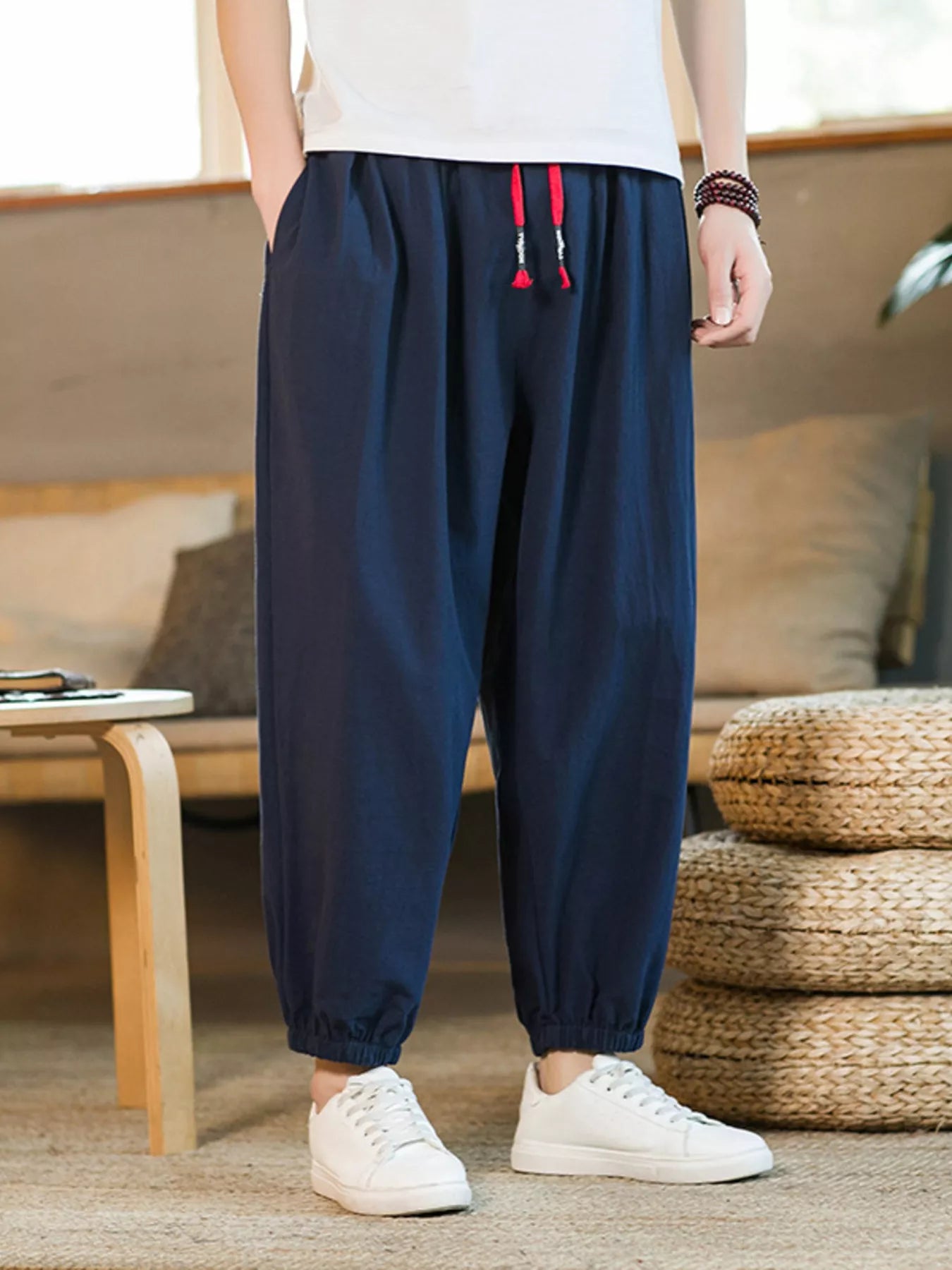 Men's loose fit joggers with a drawstring waist and pockets.