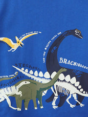 Close view of the labeled dinosaur print detail on royal blue fabric