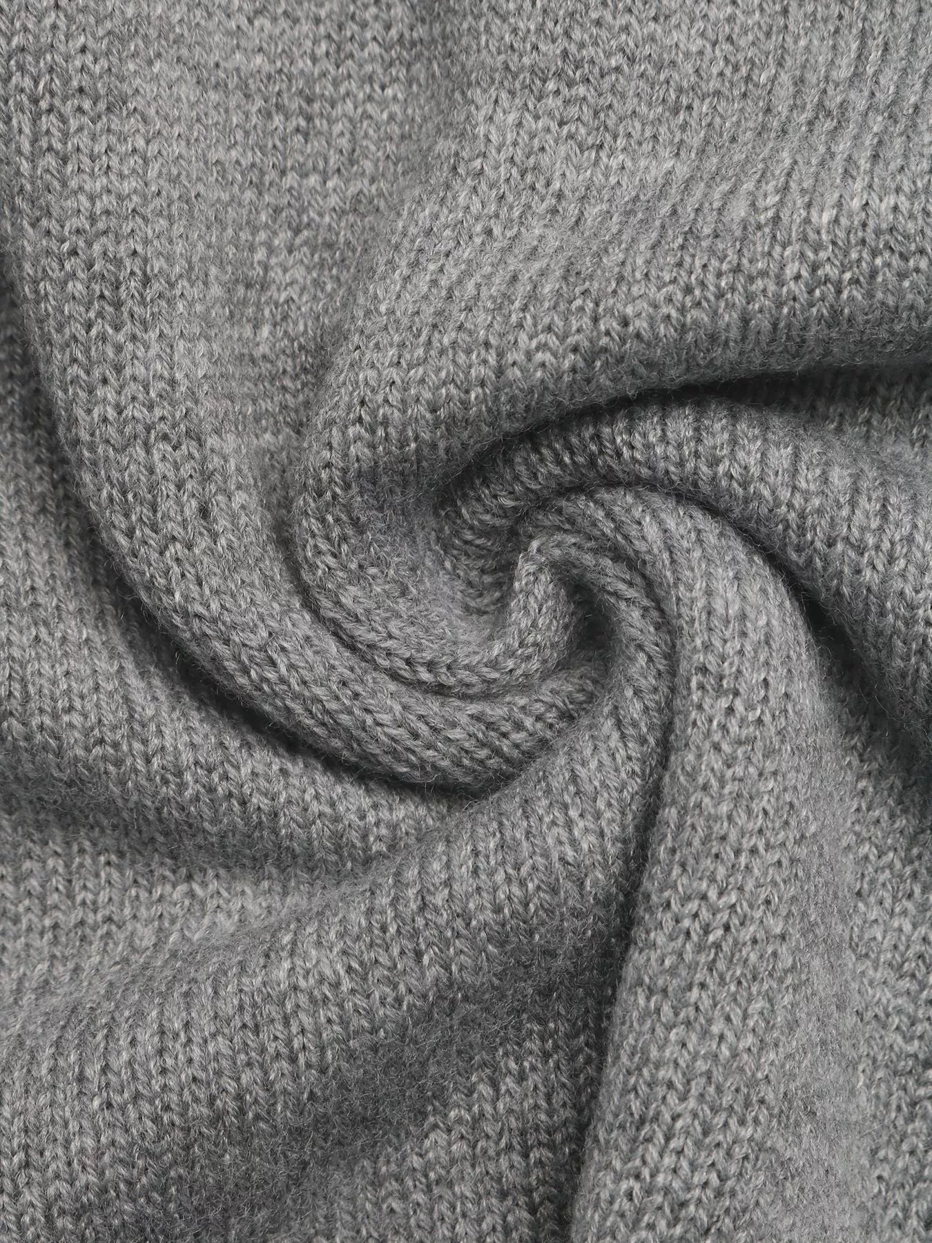 Close up of the soft gray knit fabric showing its fine texture and drape