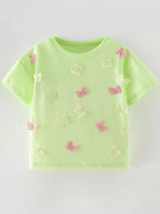 Flat front view of a light green children's tee scattered with pink and white butterfly appliques
