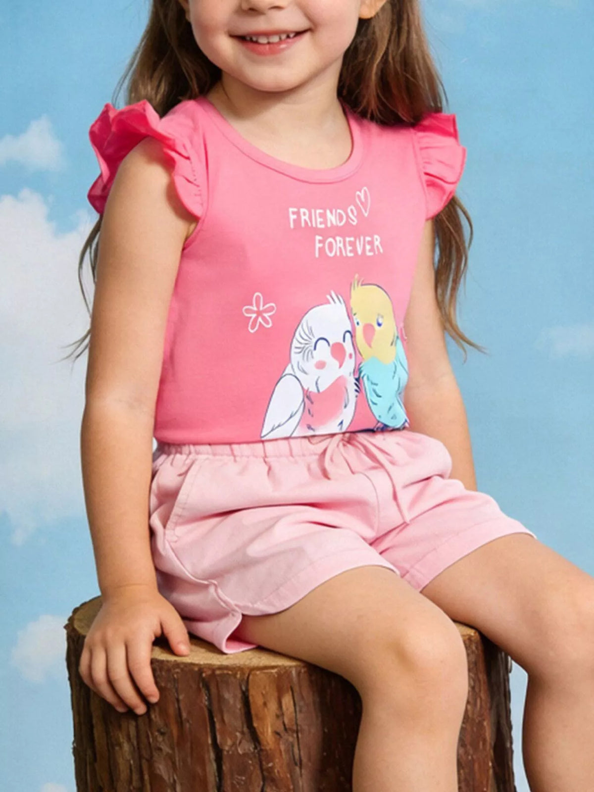 Children's pink top featuring bird graphics and ruffle sleeve detailing.