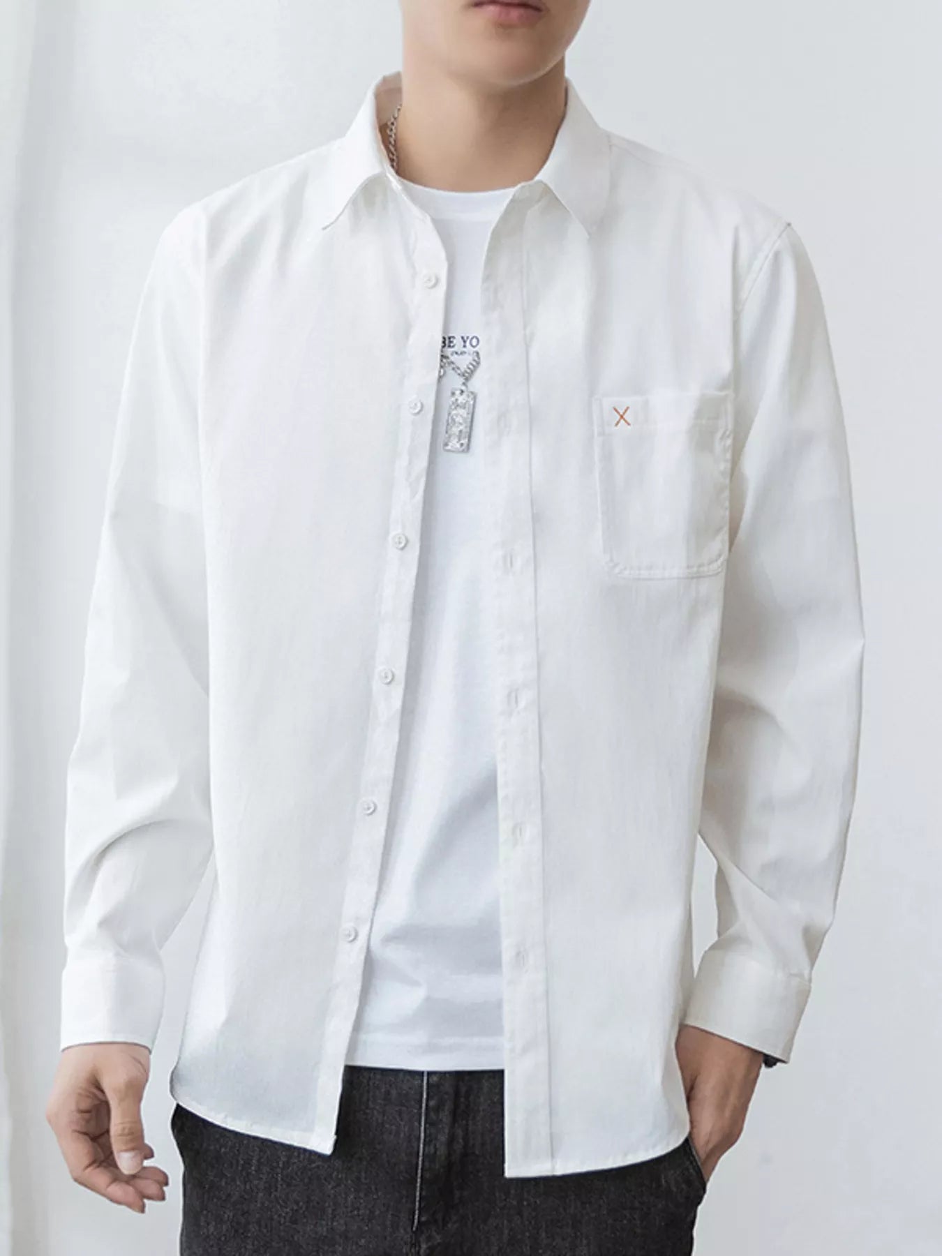 Men's oversized long-sleeve button-up shirt with pockets in a cotton-spandex blend.