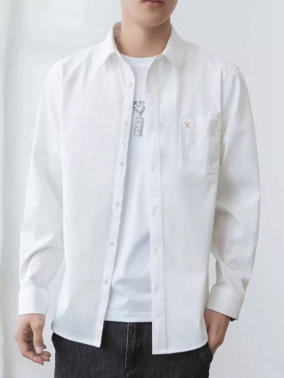 Men's oversized long-sleeve button-up shirt with pockets in a cotton-spandex blend.