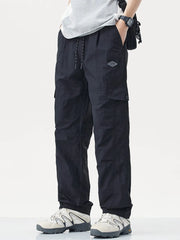 Men's plus size relaxed fit cargo pants with drawstring and pockets, product detail view.