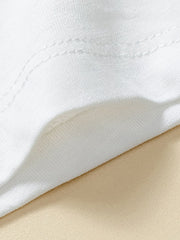 Detail view of white fabric and double stitching on the sleeve of a children's white short sleeve tee