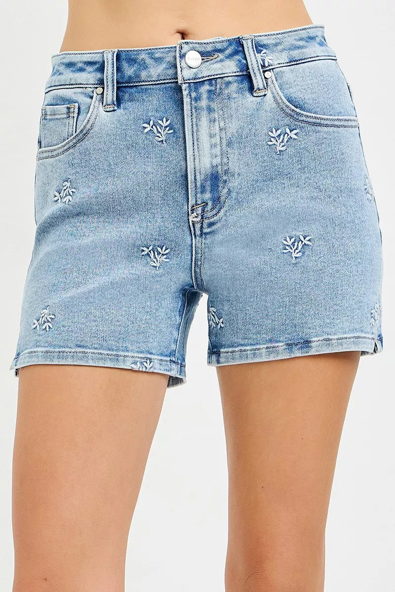 Women's high-rise denim shorts with embroidered detailing and a relaxed fit.