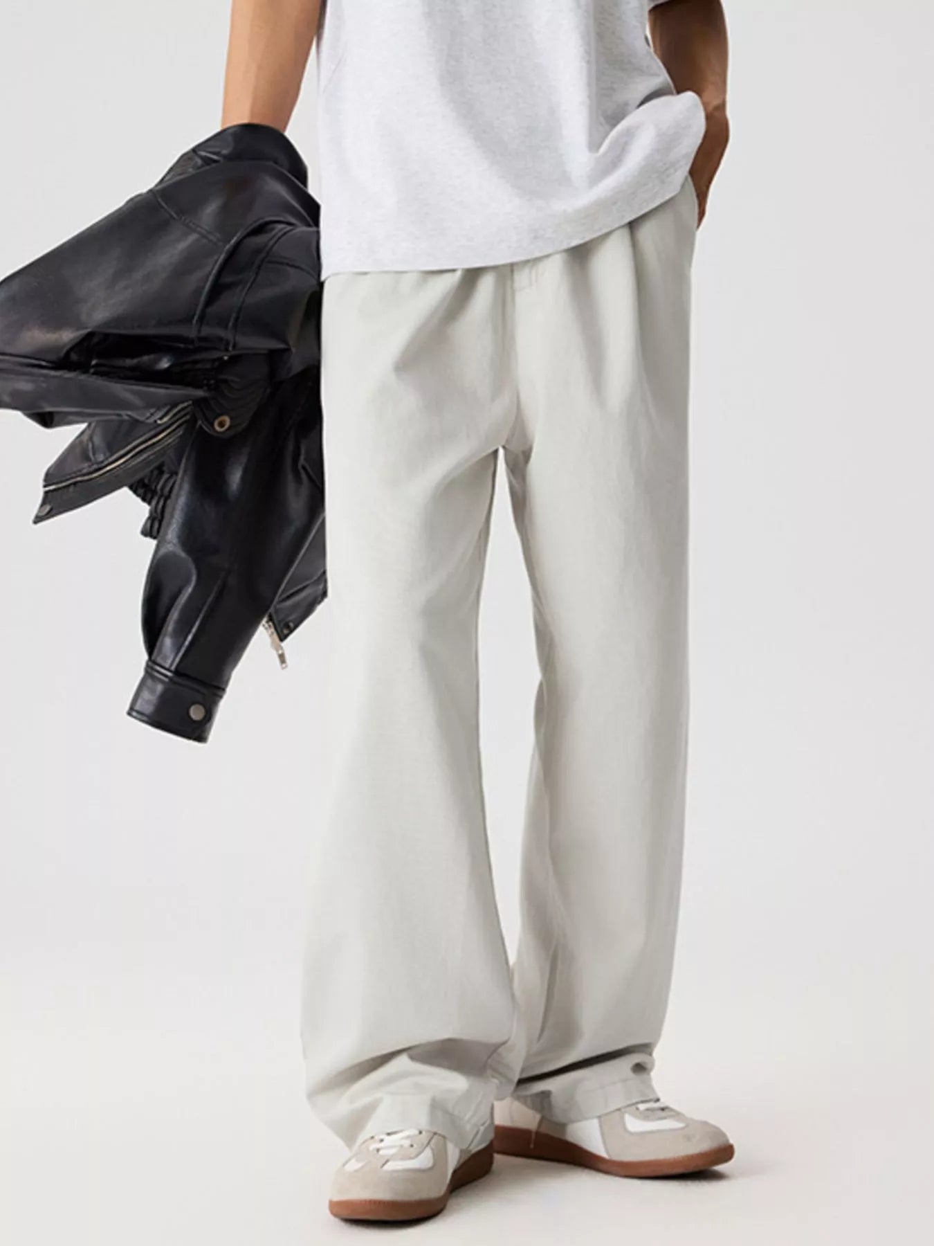 Men's relaxed fit pants with a drawstring waist and pockets.