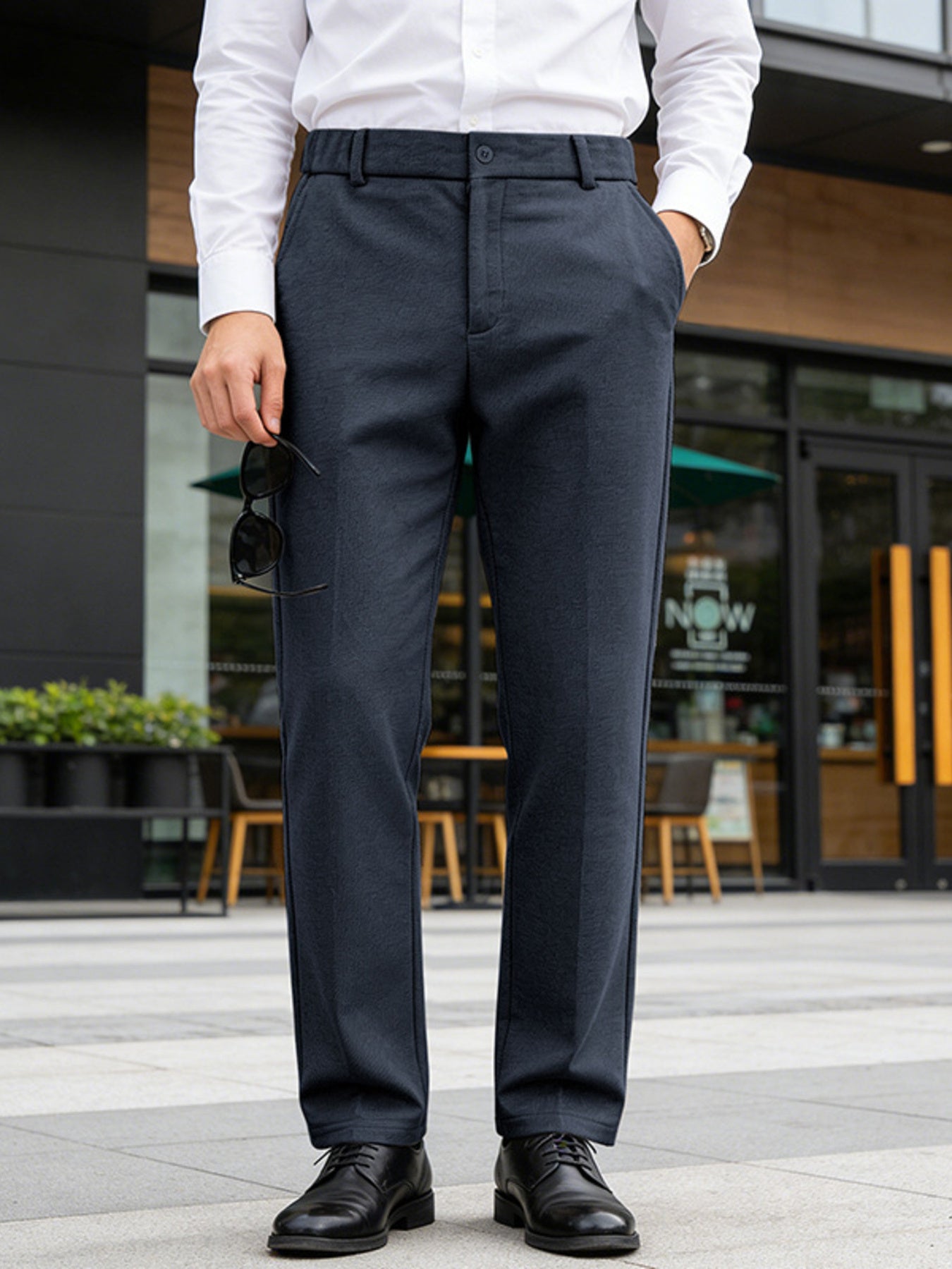 Men's navy dress pants with a classic fit and pockets.