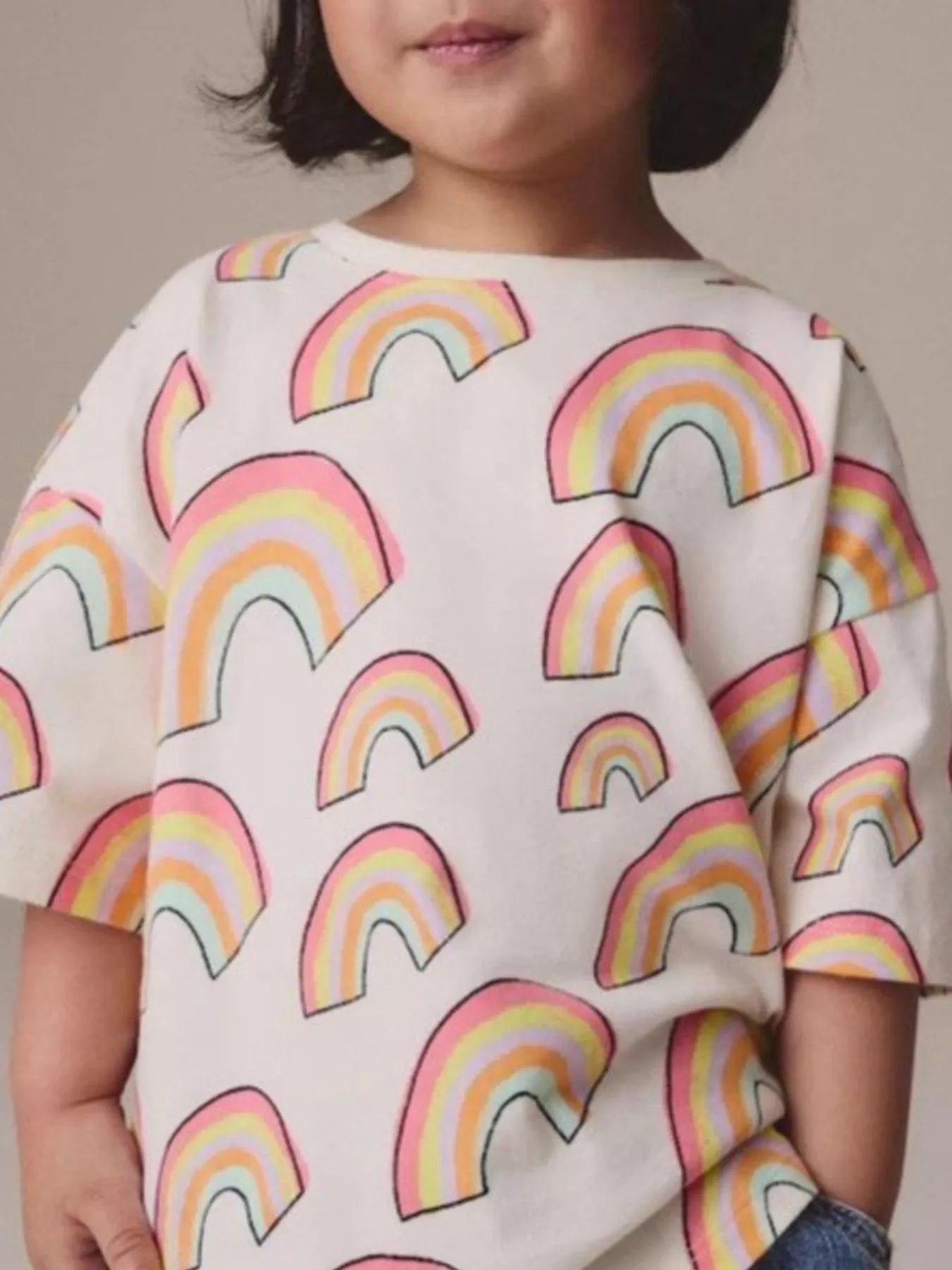 Children's white crew-neck T-shirt featuring a rainbow print design.