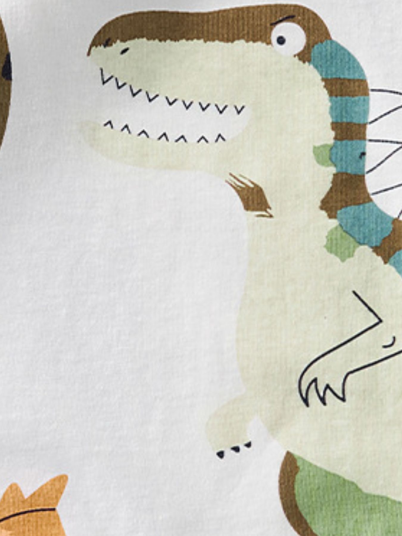 Close view of the striped dinosaur head and teeth detail on the white children's t-shirt