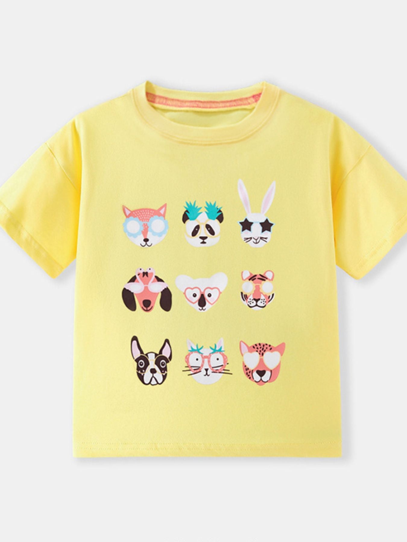Flat front view of the yellow children's t-shirt with animal faces wearing glasses