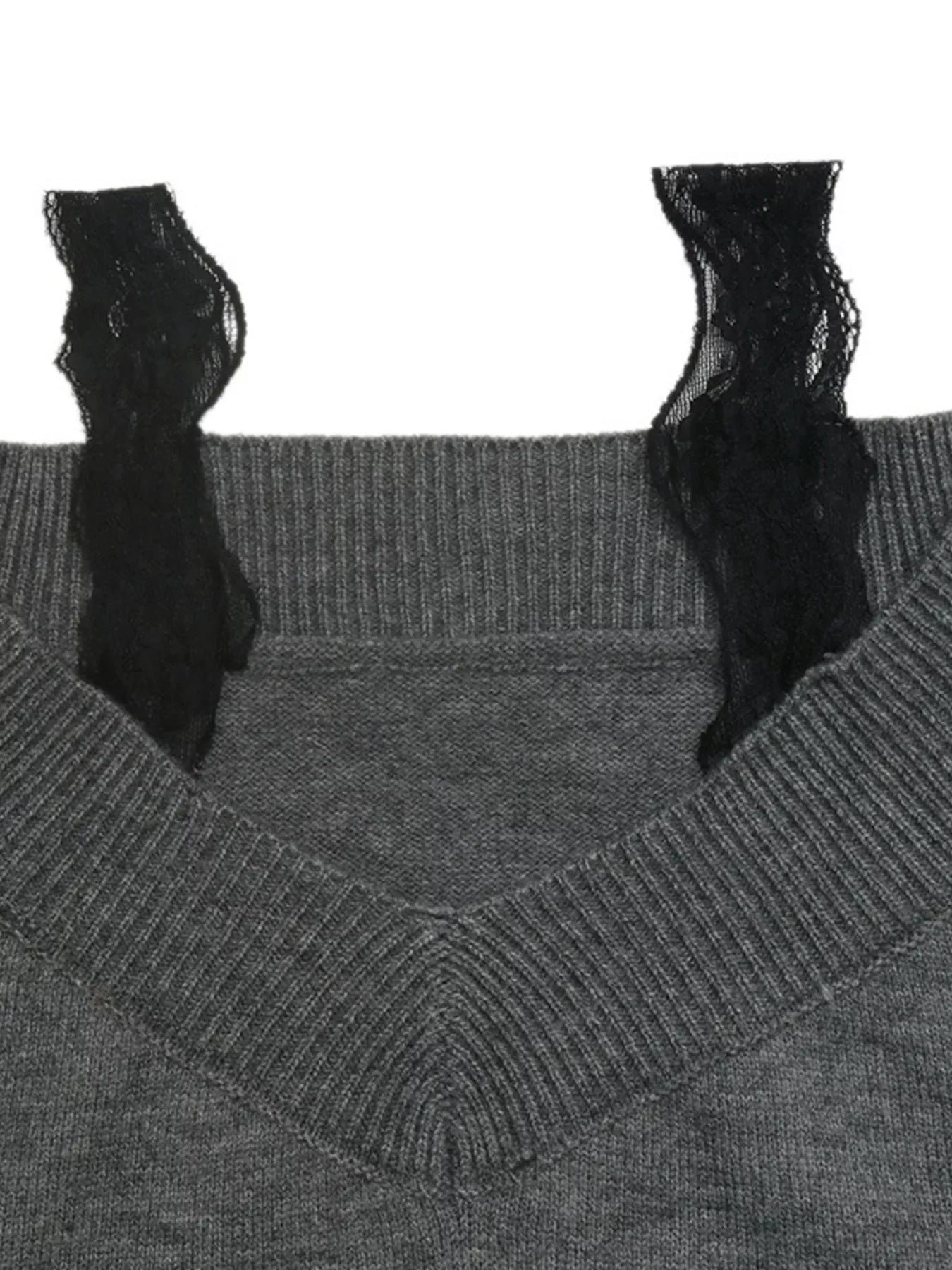 Close up of dark grey sweater black lace trim straps and ribbed neckline detail