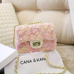 Bolsas con cierre giratorio adornadas con flores en 3D