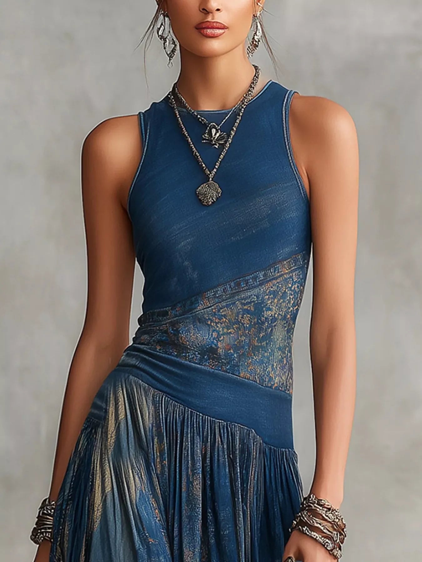 Upper bodice close up of dusty blue printed sleeveless maxi dress with round neck and waist panel