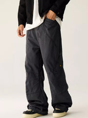 Men's dark gray wide leg cargo pants with pockets.