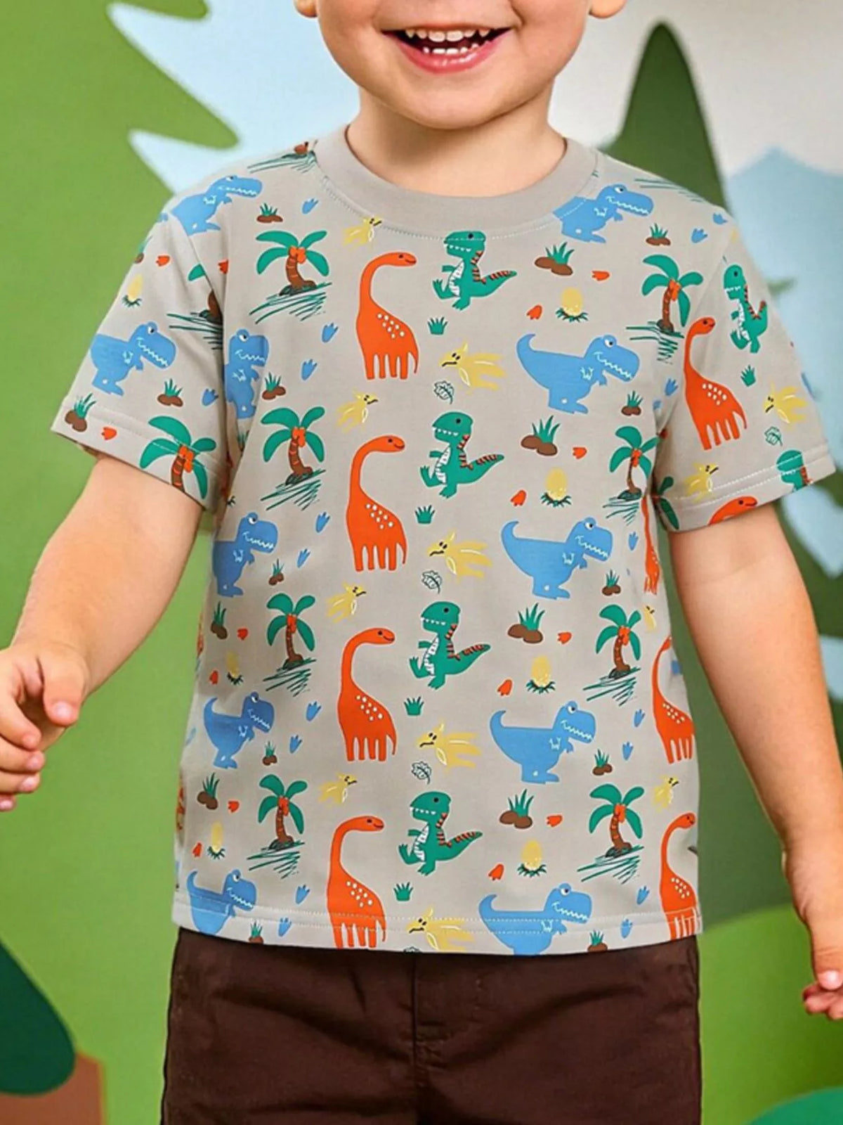 Children's multicolor crew-neck T-shirt featuring a dinosaur print and short sleeves.