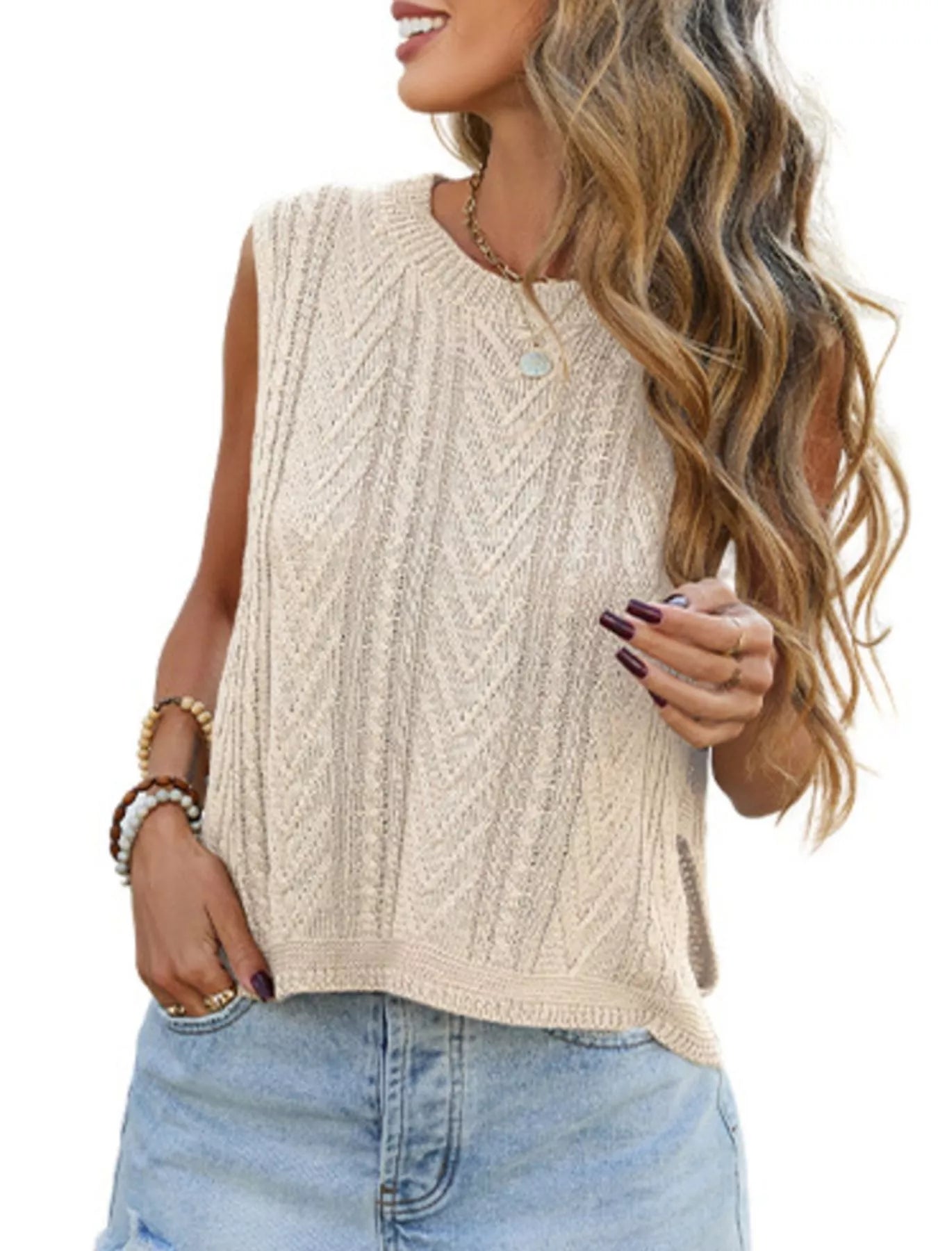 Close on-model front view of an apricot chevron knit sweater vest with round neck