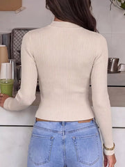 Back view of cream ribbed knit top with long sleeves and plain ribbed back