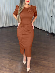 Full length front view of a light brown ruched bodycon midi dress with a front slit