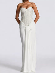 White strapless sequin corset maxi dress with draped waist on model, full length studio front view