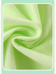 Close view of the light green children's tee fabric gathered in soft folds showing its knit texture