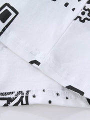 Close-up of the white hem and sleeve seam stitching beside a black vehicle print