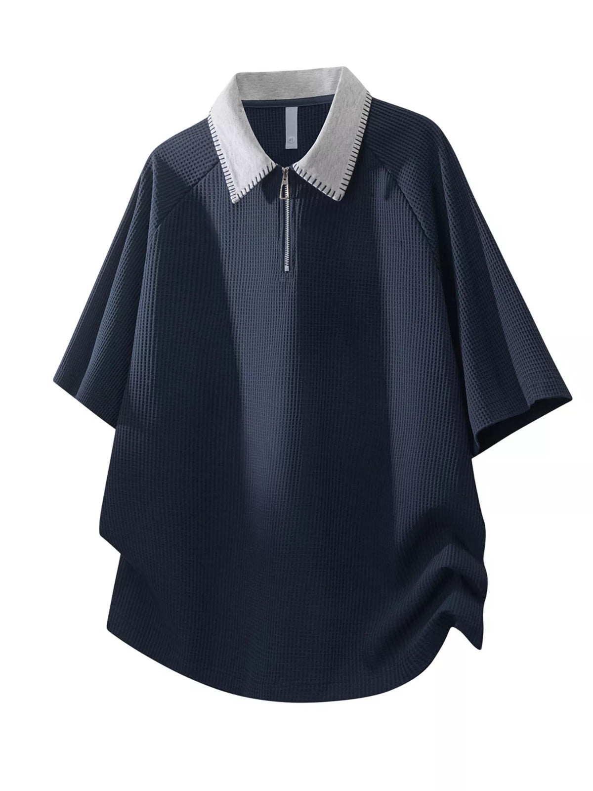 Men's waffle-knit polo with a half-zip neckline in a cotton-spandex blend.