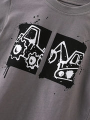 Close view of the black and white tractor and excavator graphic on dark gray fabric