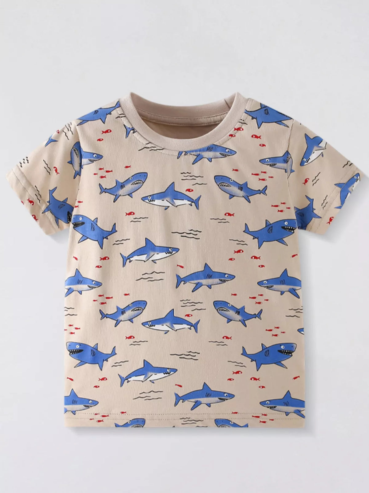 Front view of tan children's crew neck tee with all over blue shark print