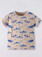Front view of tan children's crew neck tee with all over blue shark print